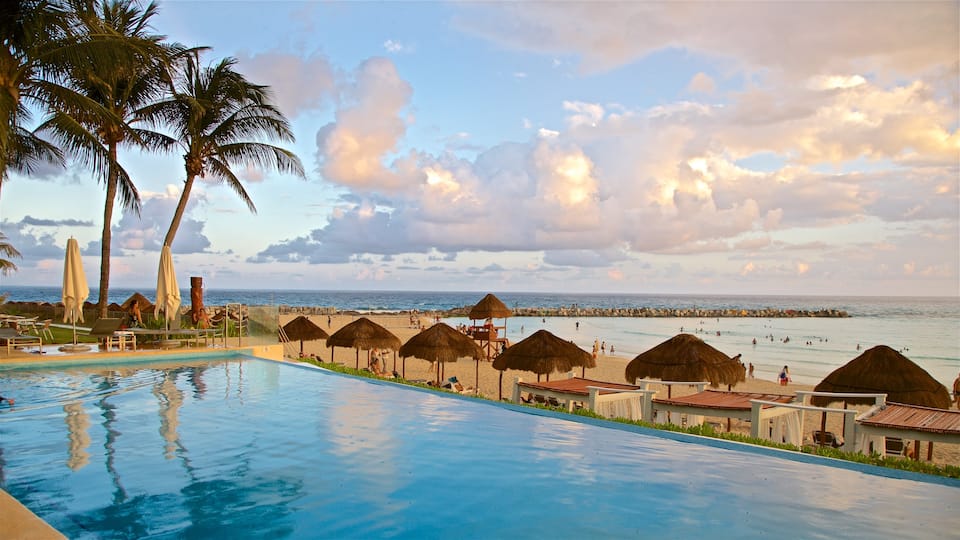 Hotel Zone featuring landscape views, a pool and a sunset