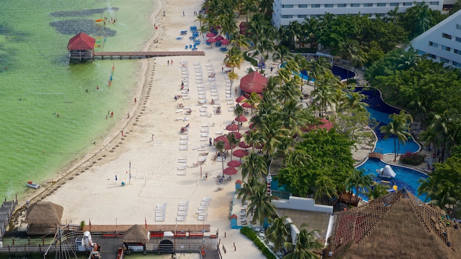 Escenica Tower which includes a luxury hotel or resort, general coastal views and a sandy beach