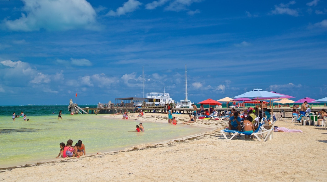 Playa Langosta showing swimming, general coastal views and a beach