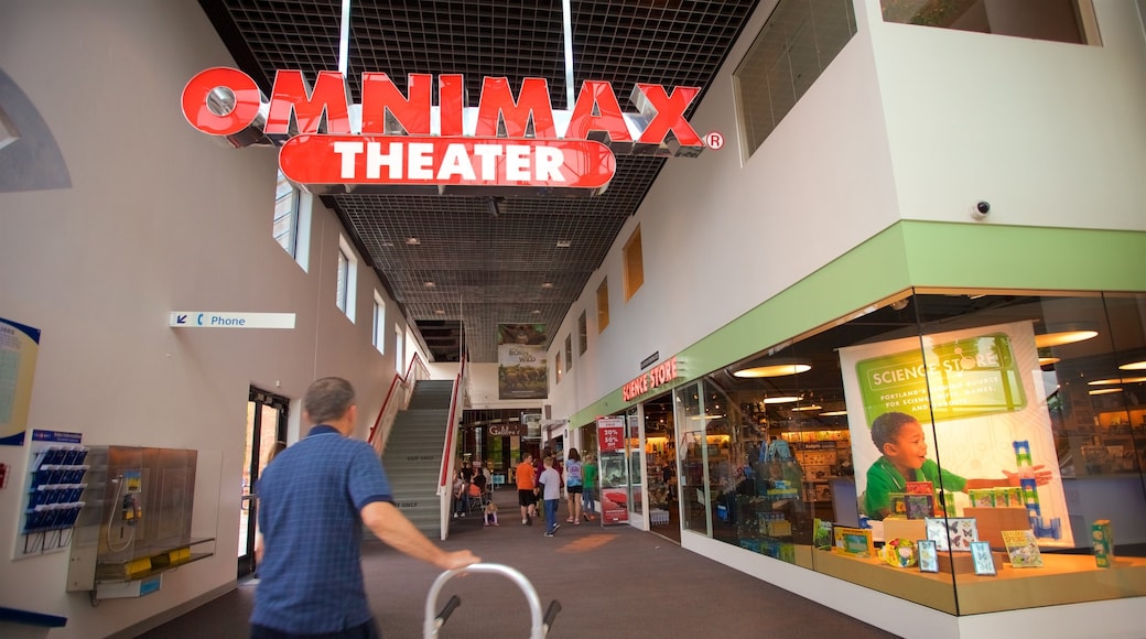 Oregon Museum of Science and Industry featuring signage and interior views as well as an individual male