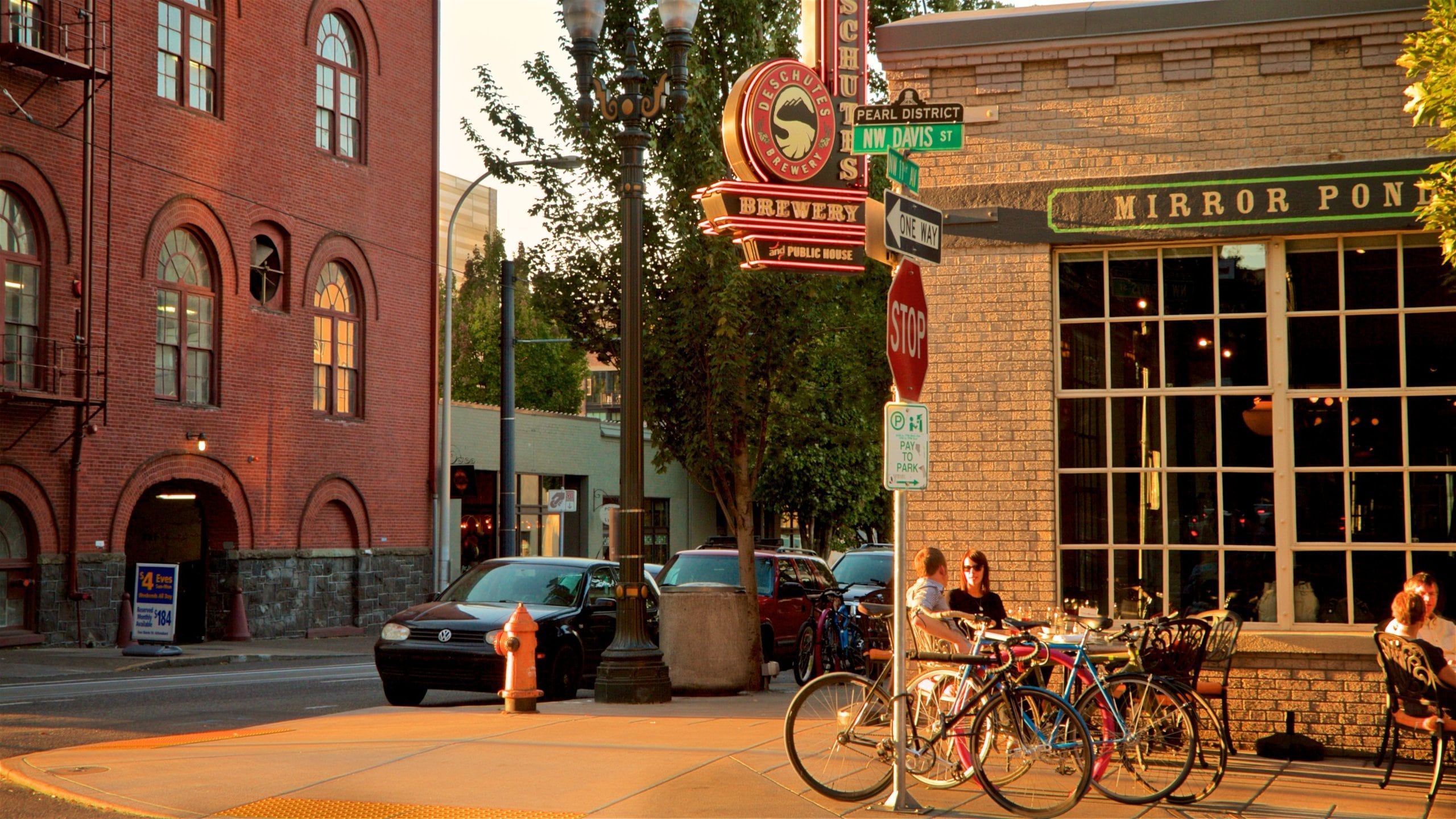 Downtown Portland - South Waterfront showing outdoor eating as well as a couple