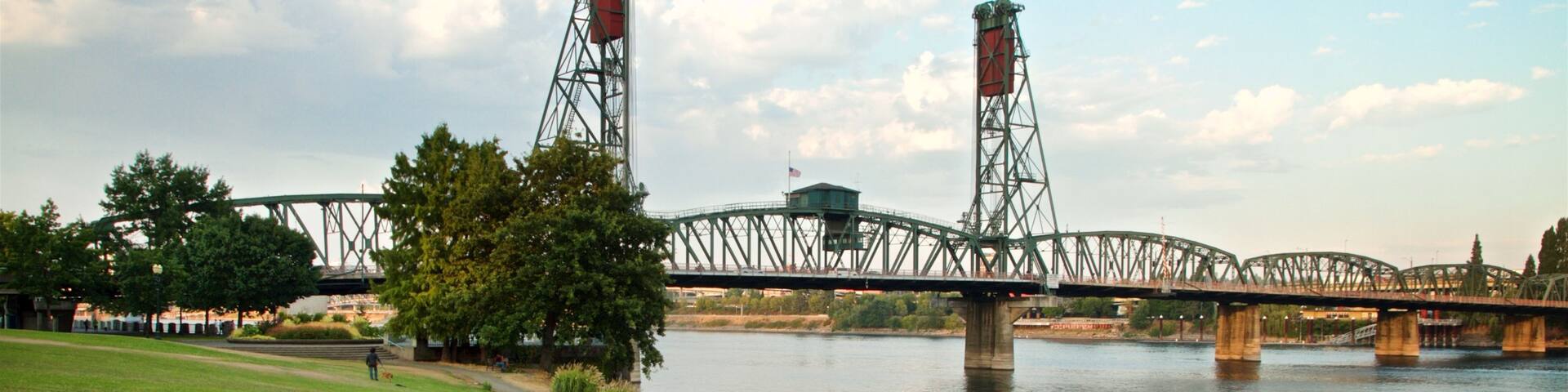 Tom McCall Waterfront Park featuring a bridge, bird life and a river or creek