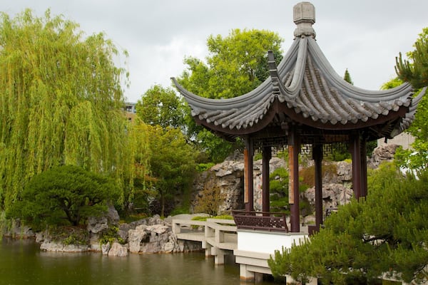 Lan Su Chinese Garden featuring a pond, heritage elements and a park