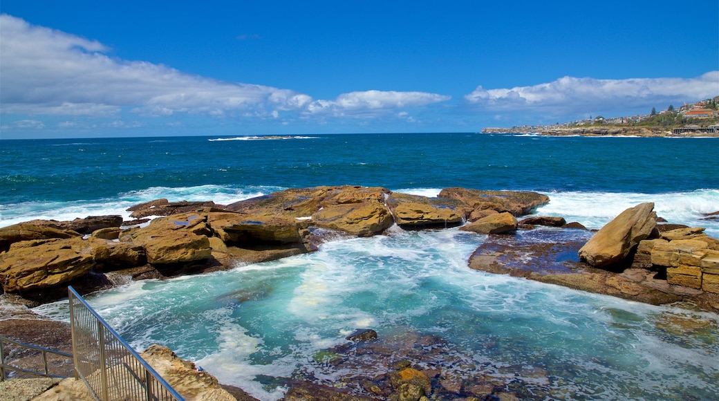 Coogee Beach which includes rocky coastline and general coastal views