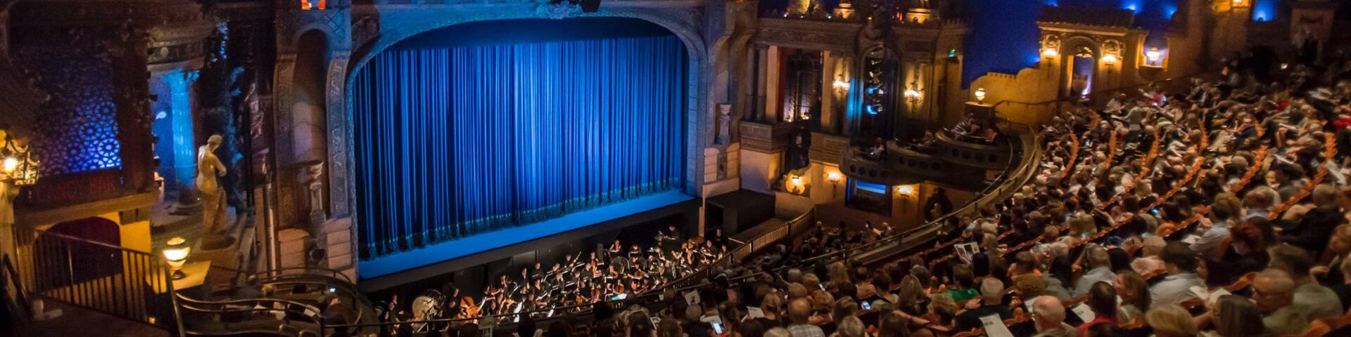 Capitol Theatre showing interior views and theater scenes as well as a large group of people