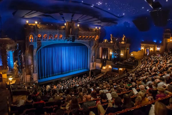 Capitol Theatre showing theatre scenes and interior views as well as a large group of people