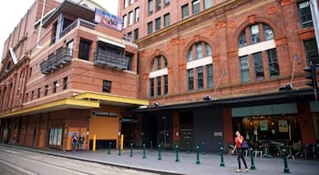 Capitol Theatre showing street scenes as well as an individual femail