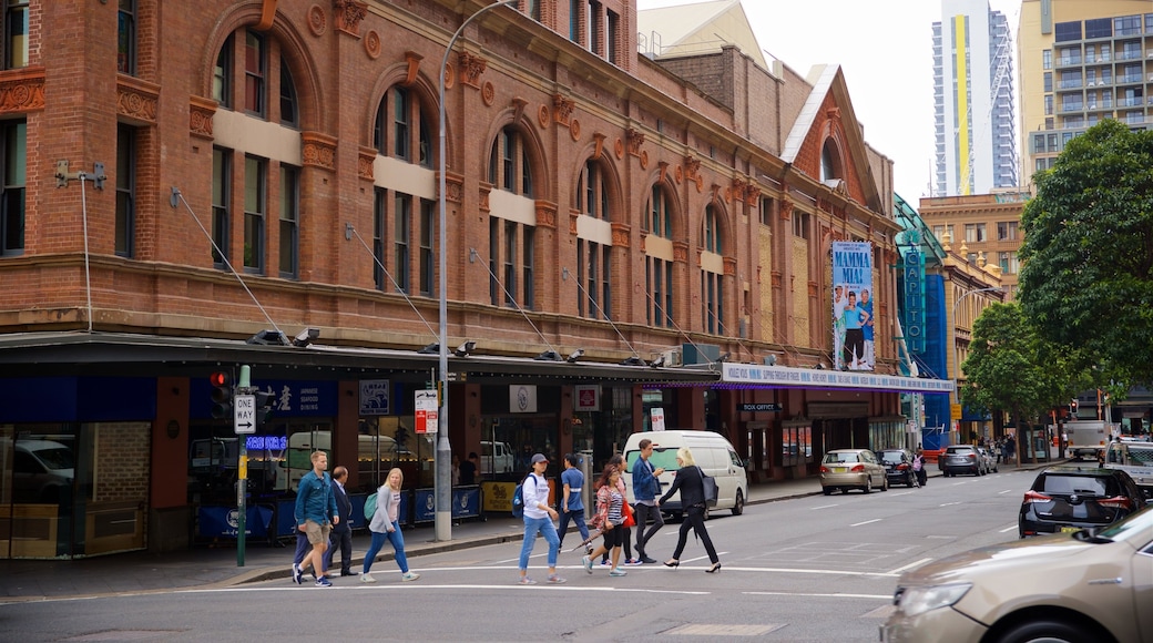 Capitol Theatre showing street scenes as well as a small group of people