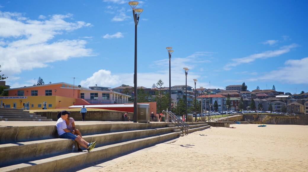 Maroubra Beach som omfatter en sandstrand og en kystby såvel som et par