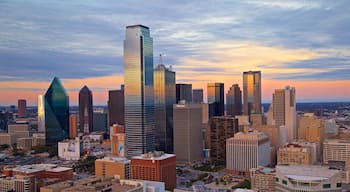 Reunion Tower showing landscape views, a sunset and a skyscraper