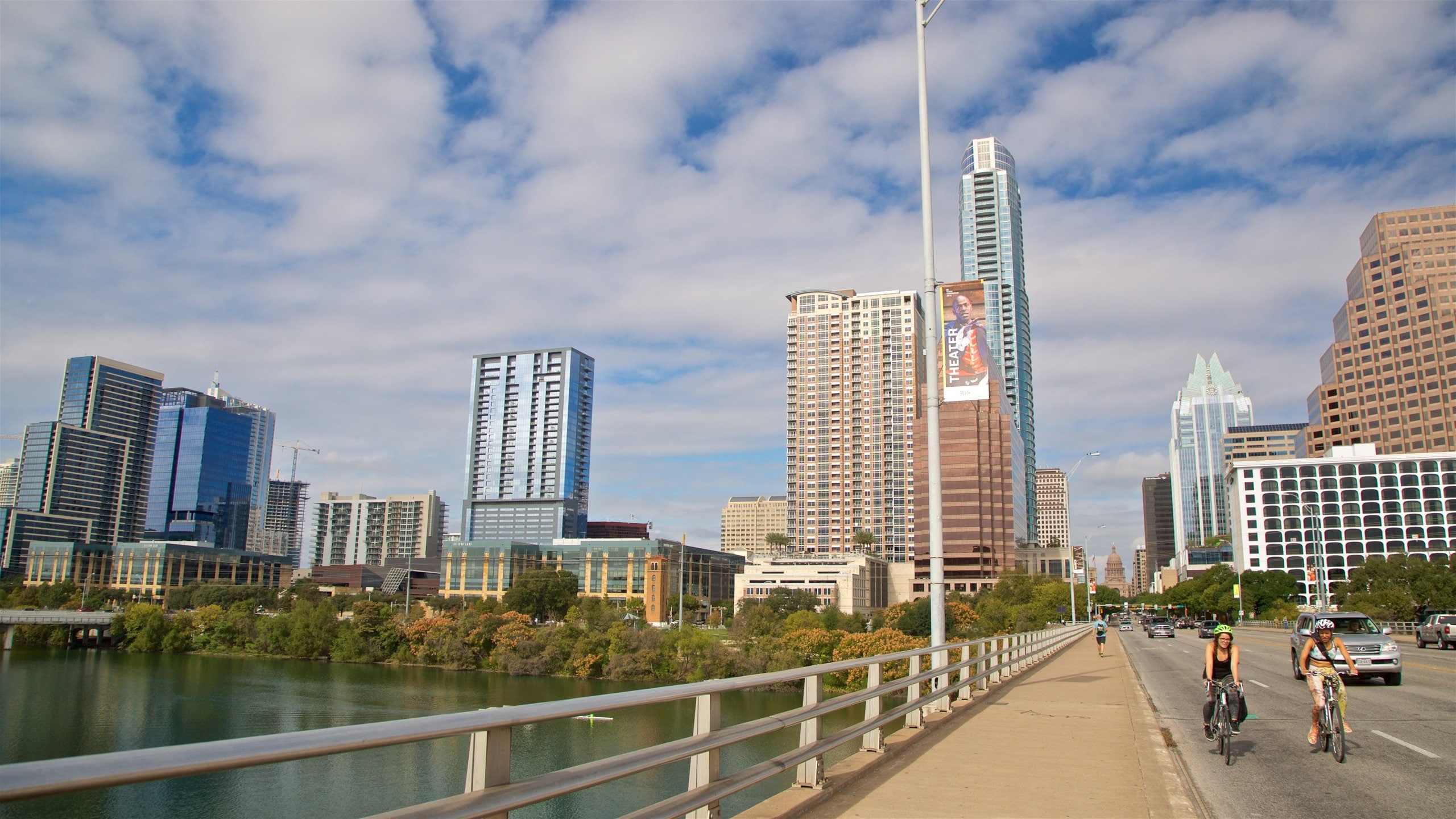 Ann W. Richards Congress Avenue Bridge showing a river or creek, road cycling and a city
