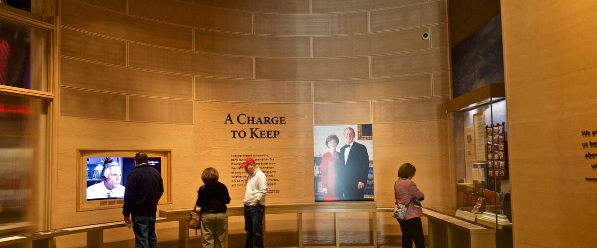 George W Bush Presidential Library and Museum featuring interior views as well as a small group of people