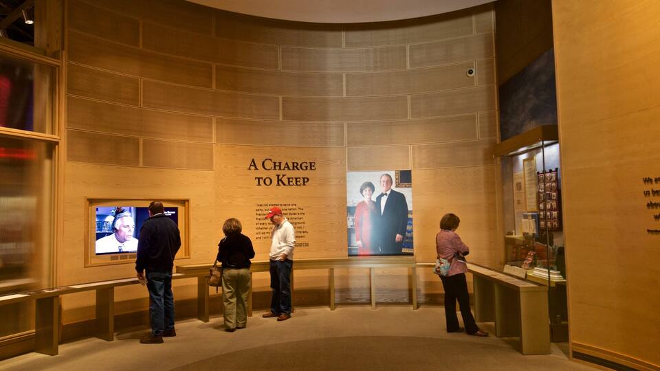 George W Bush Presidential Library and Museum featuring interior views as well as a small group of people