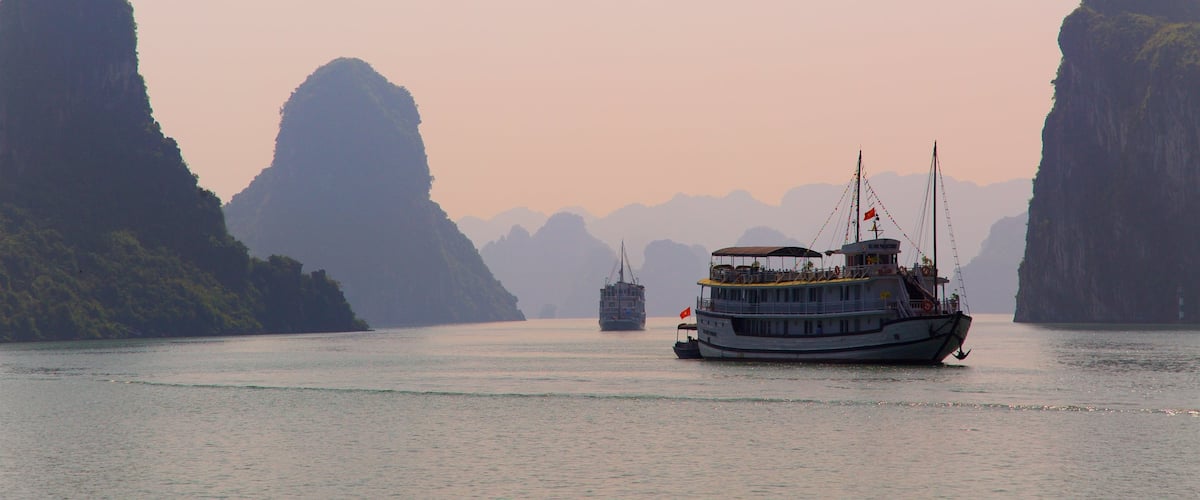 Vietnam which includes general coastal views, a sunset and cruising