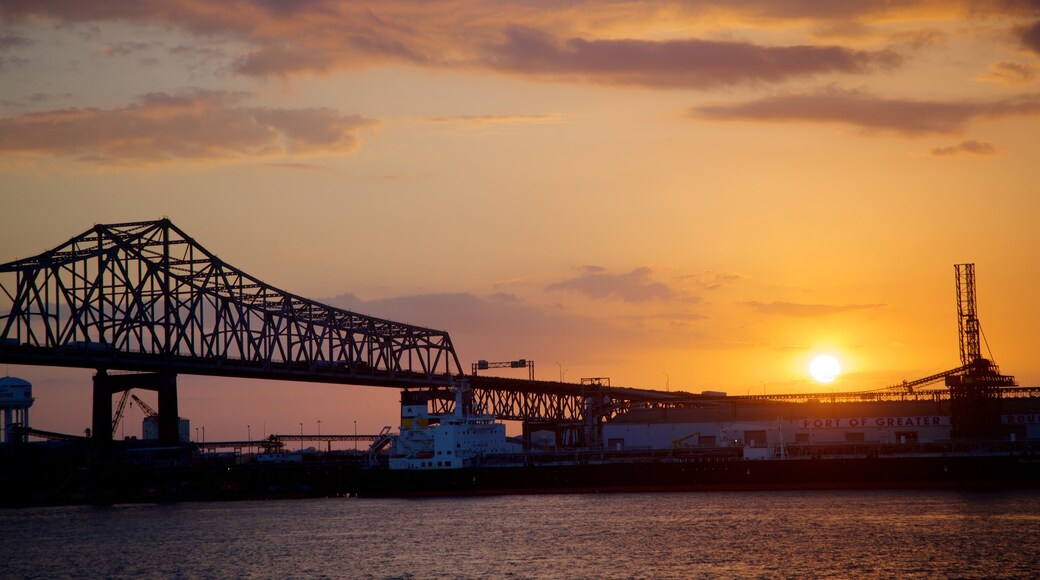 Howard Wilkinson Bridge which includes a sunset, a bridge and a river or creek