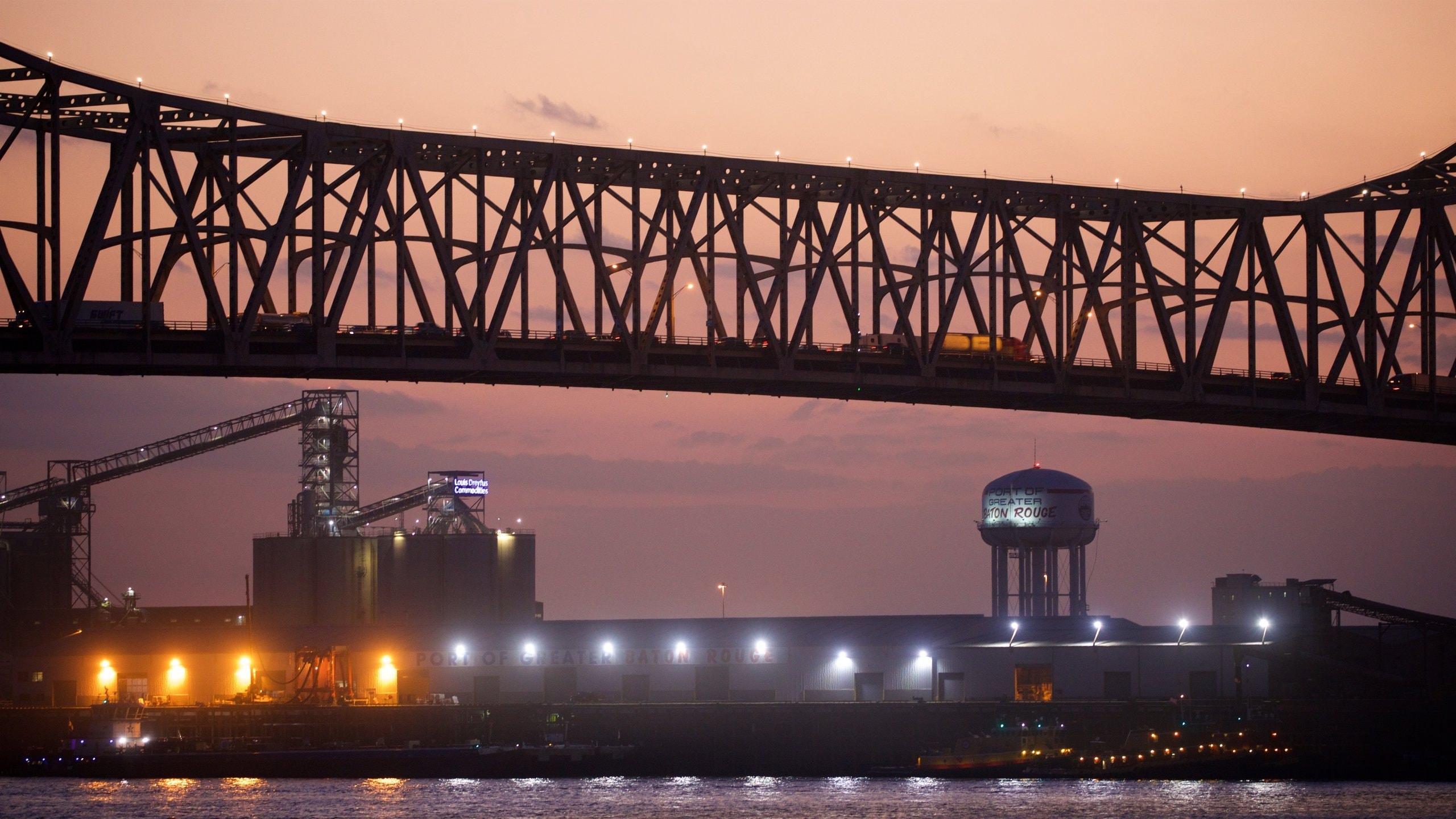 Howard Wilkinson Bridge showing a river or creek, a bridge and a sunset
