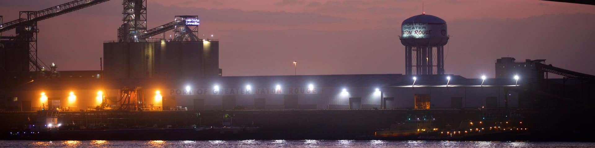 Howard Wilkinson Bridge showing a river or creek, a bridge and a sunset