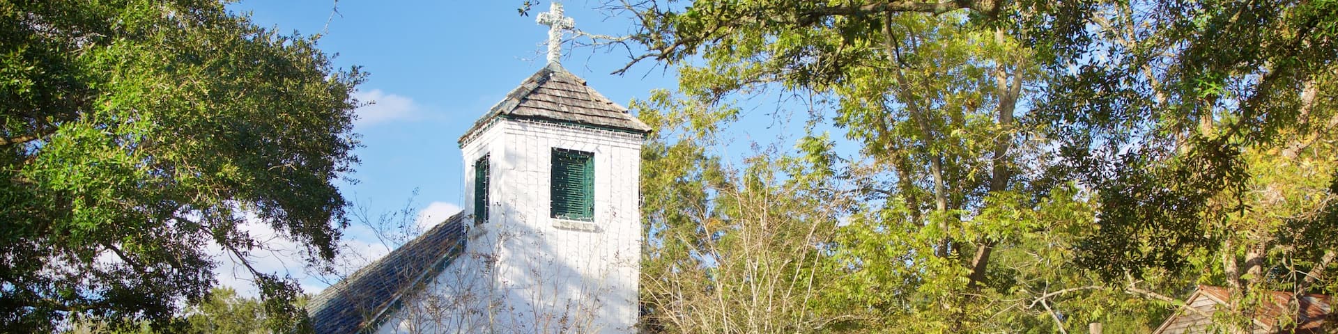 Acadian Village which includes a church or cathedral