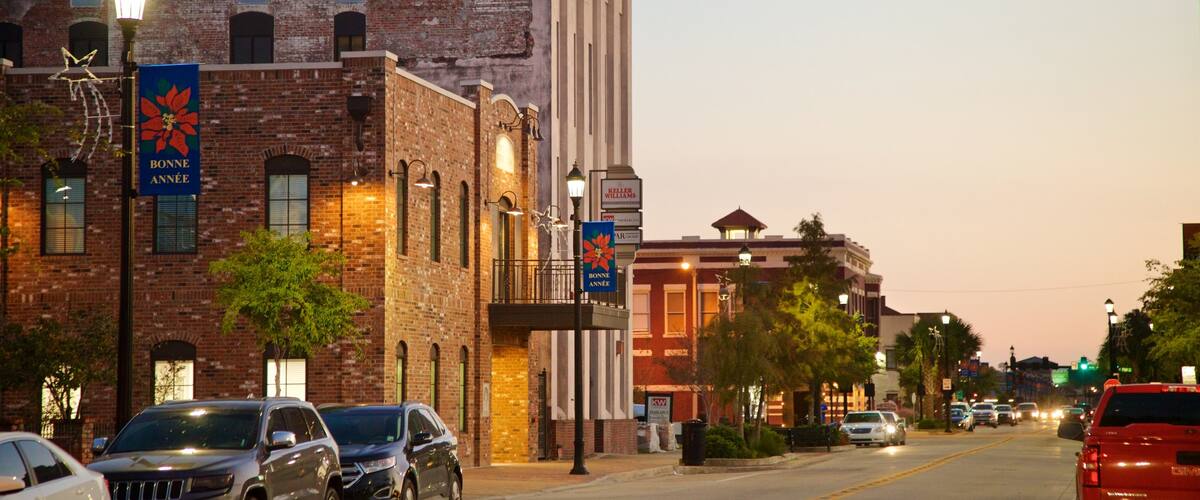 Lake Charles Historic District featuring a sunset