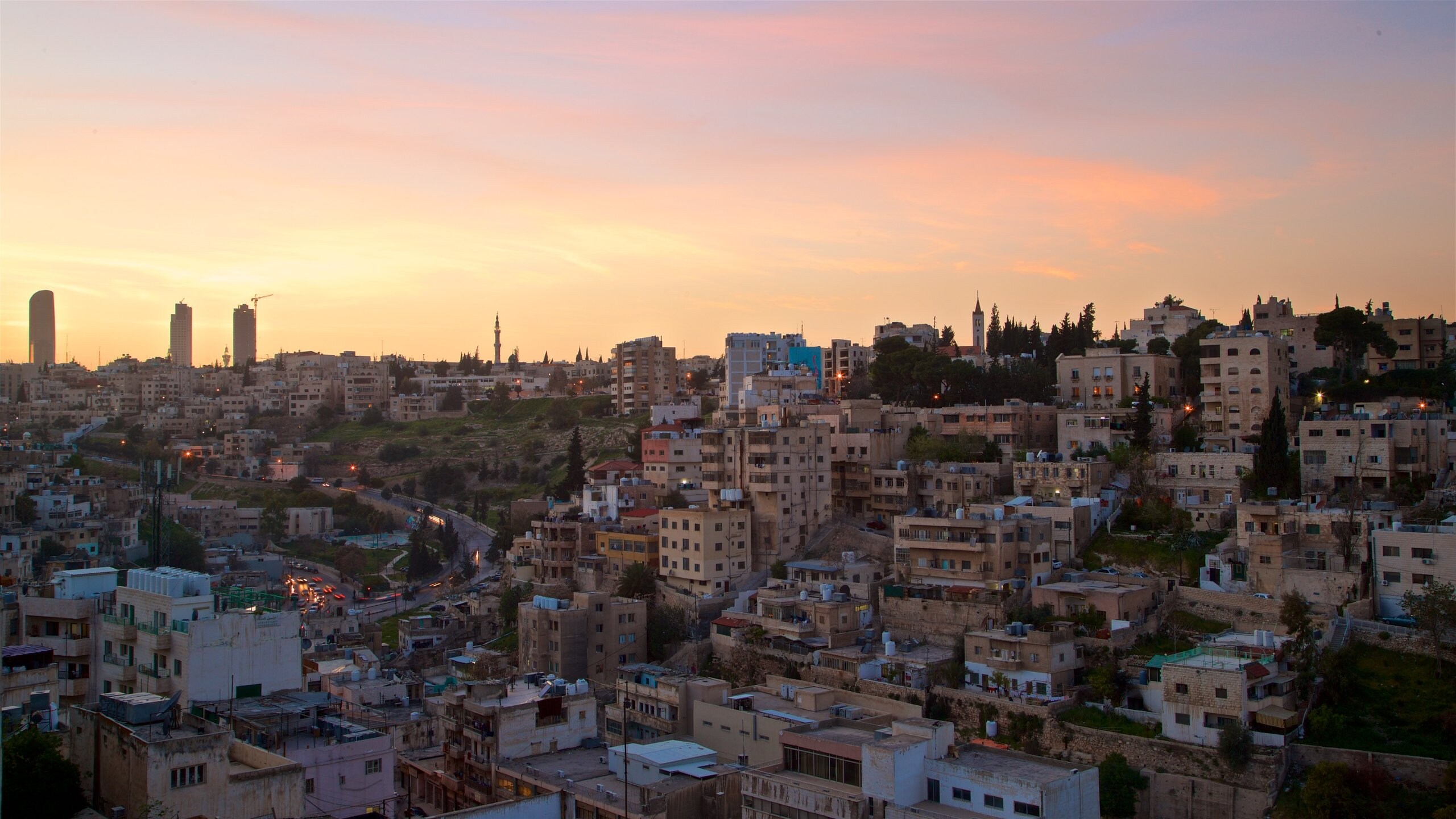 Jordan which includes a sunset, landscape views and a city