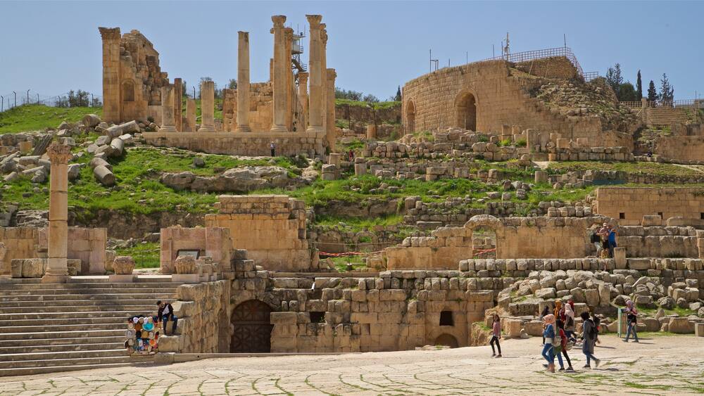 Jerash which includes heritage architecture and building ruins as well as a small group of people