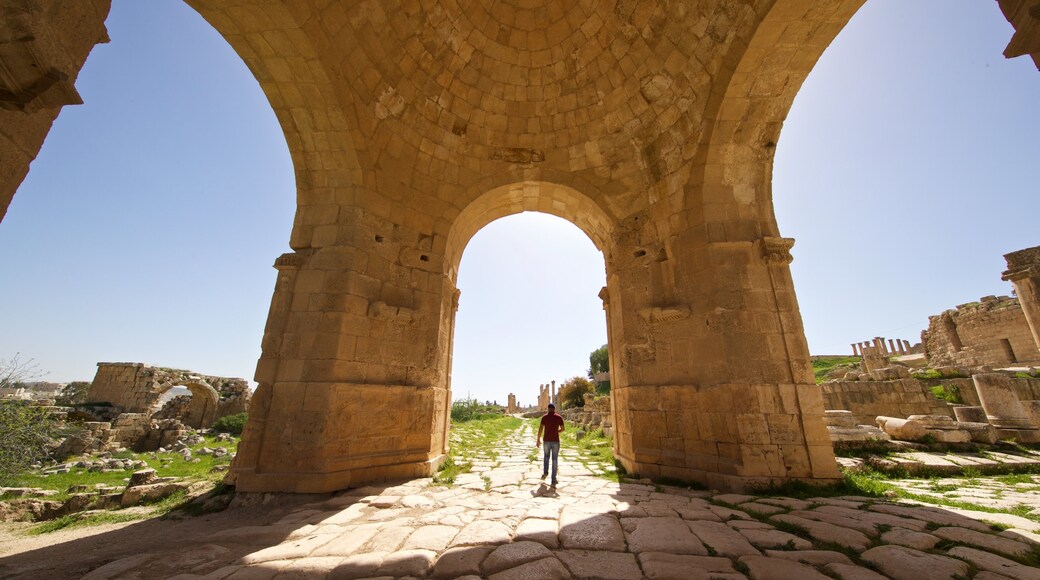 Jerash showing building ruins and heritage architecture as well as an individual male