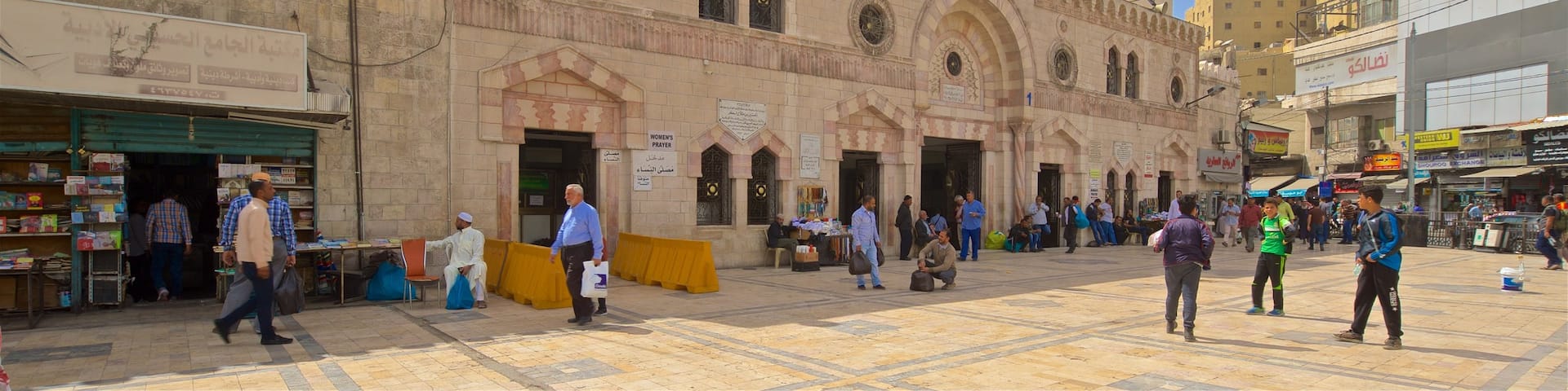 King Hussein Mosque which includes heritage elements and street scenes as well as a small group of people