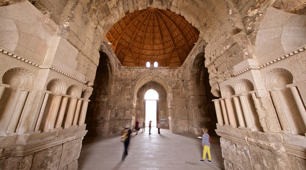 Ummayed Palace featuring heritage elements and interior views as well as a small group of people