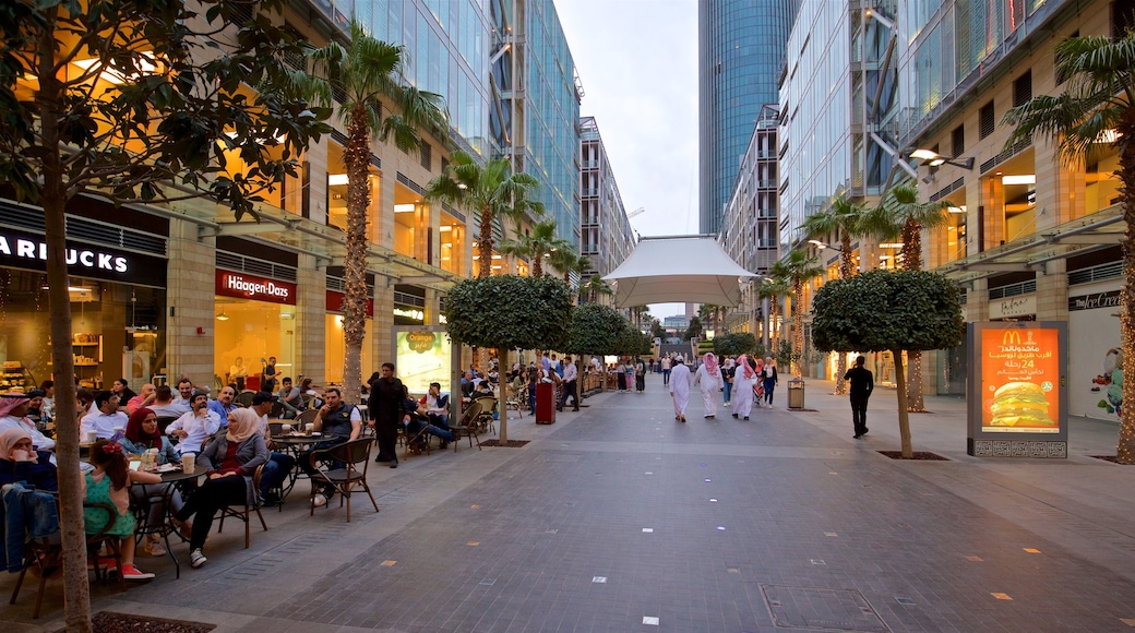 Al Abdali Mall which includes outdoor eating as well as a small group of people