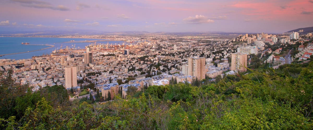 Haifa Port showing landscape views, a sunset and a city
