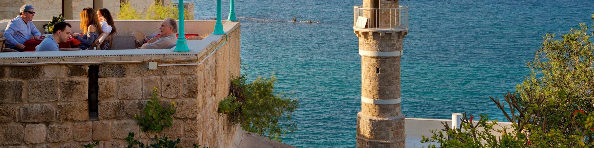Sea Mosque showing a sunset, heritage elements and general coastal views