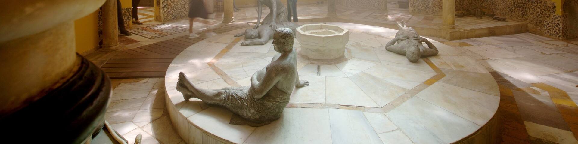 Hamam al- Basha Turkish Bath featuring interior views, heritage elements and a statue or sculpture