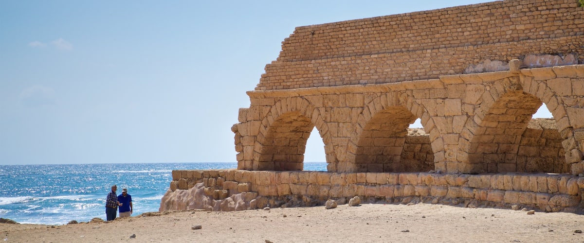 St Maarten and St Martin showing general coastal views, a beach and heritage elements