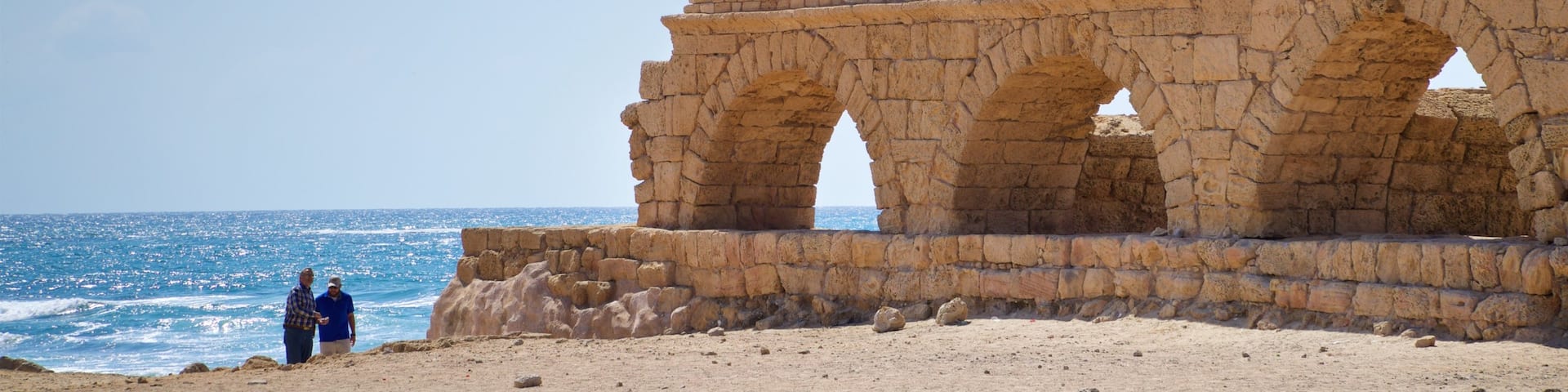 St Maarten and St Martin showing general coastal views, a beach and heritage elements