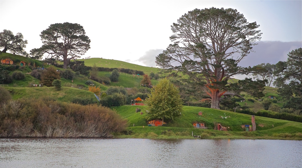 Hobbiton Movie Set featuring landscape views, a lake or waterhole and tranquil scenes