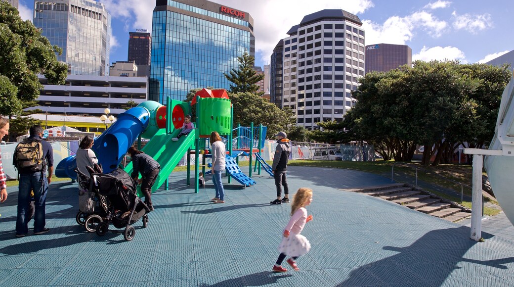 Frank Kitts Park which includes a playground and a city as well as a family