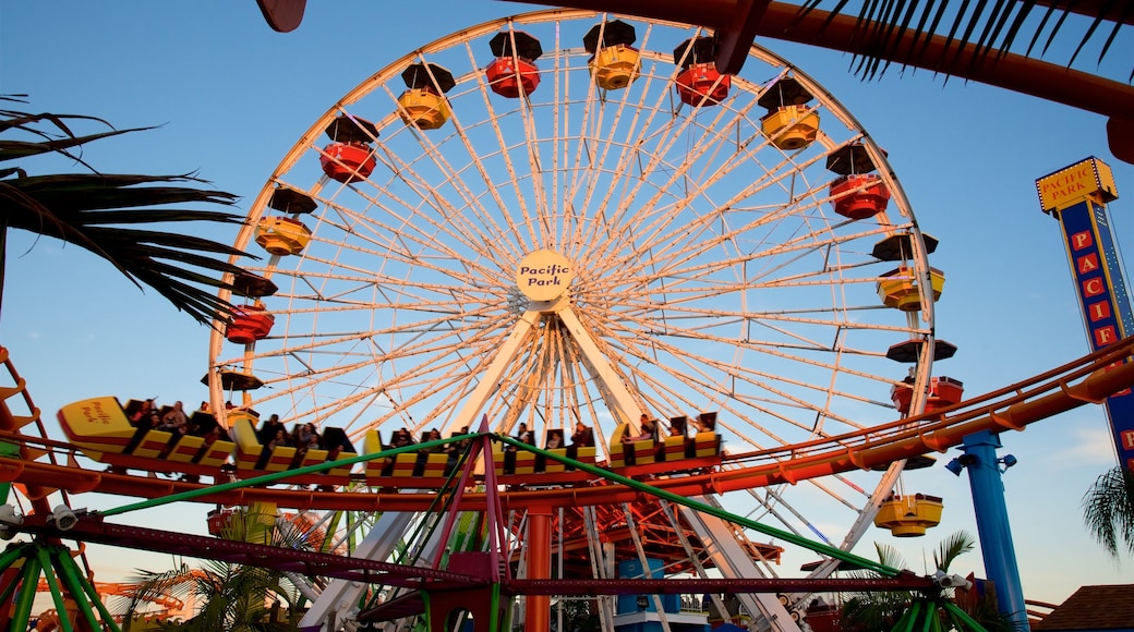 Santa Monica Pier showing rides and a sunset