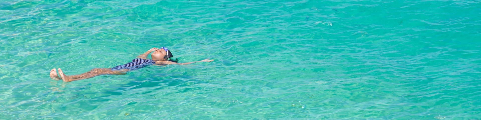 Chileno Beach showing general coastal views, swimming and tropical scenes
