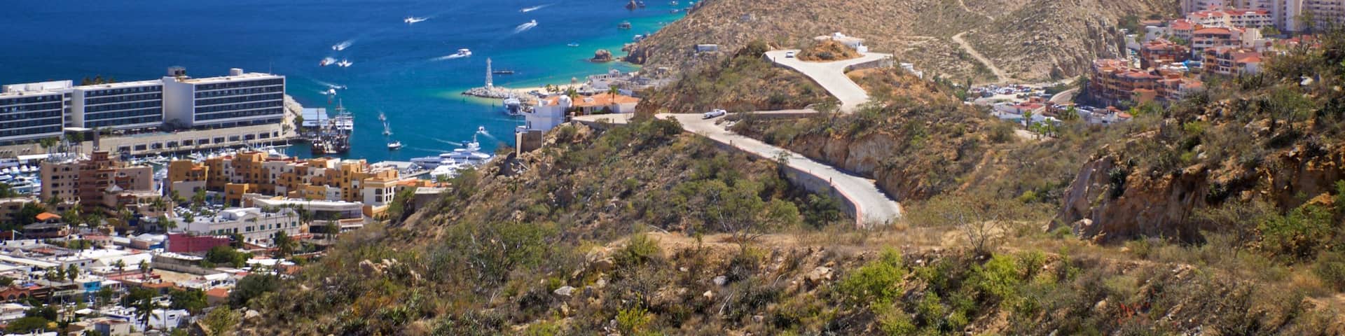 Cerro de la Z which includes a coastal town, landscape views and general coastal views