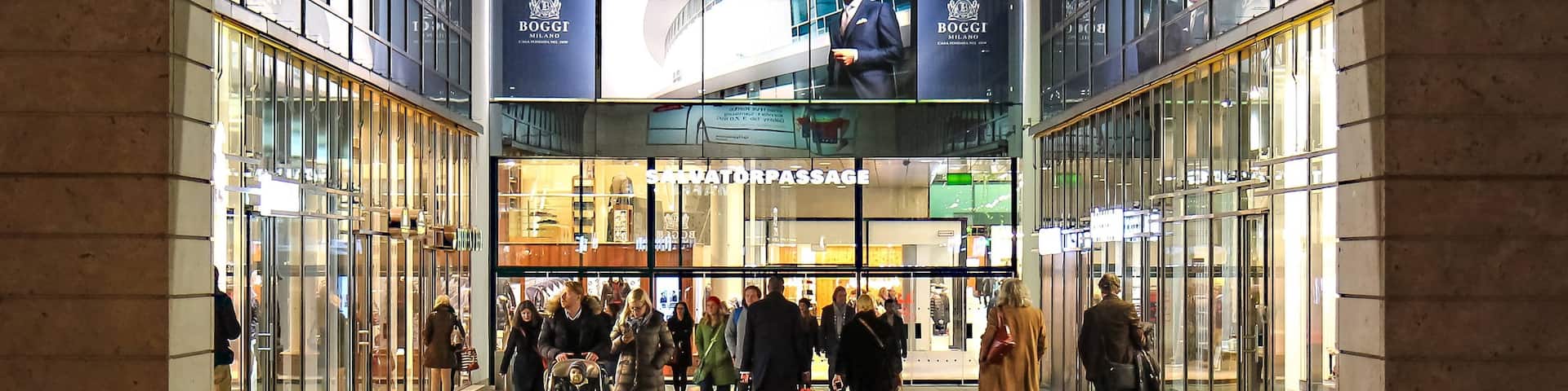 Funf Hofe featuring night scenes and street scenes as well as a small group of people