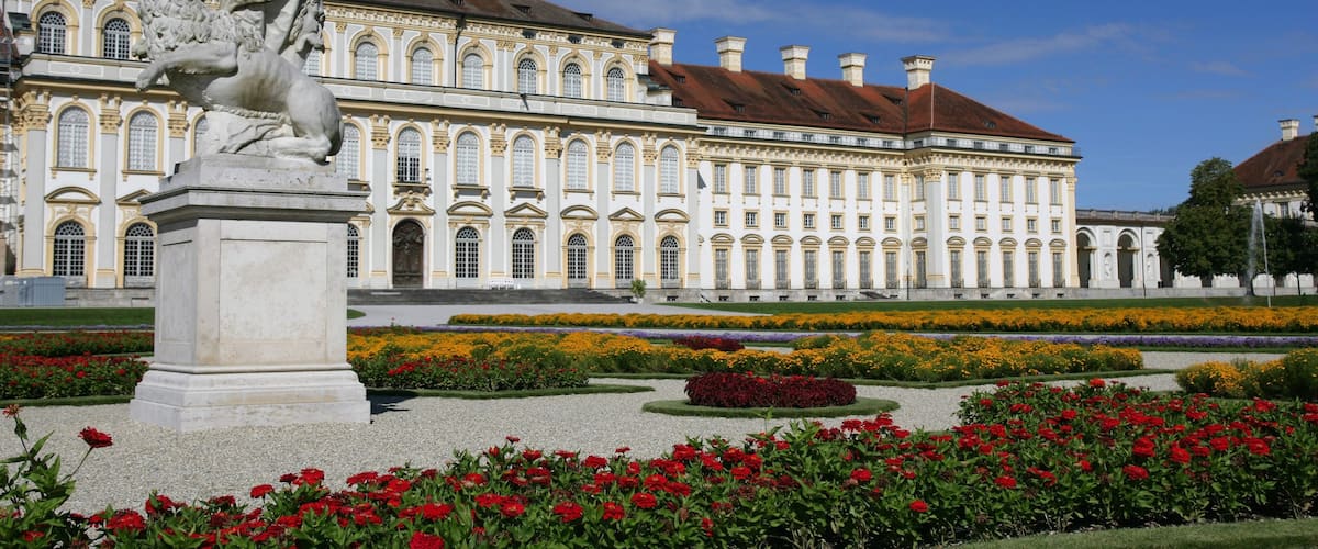 Schleissheim Palace featuring heritage architecture, a garden and wildflowers