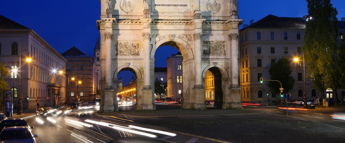Siegestor showing a city, night scenes and heritage elements