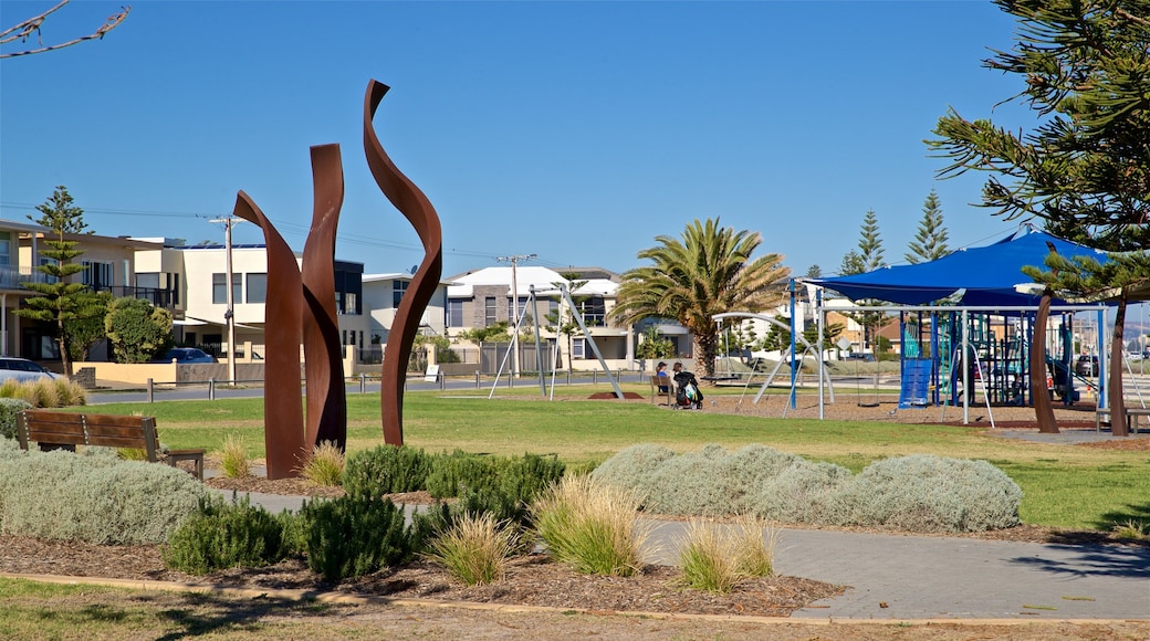 West Beach featuring outdoor art, a playground and a park