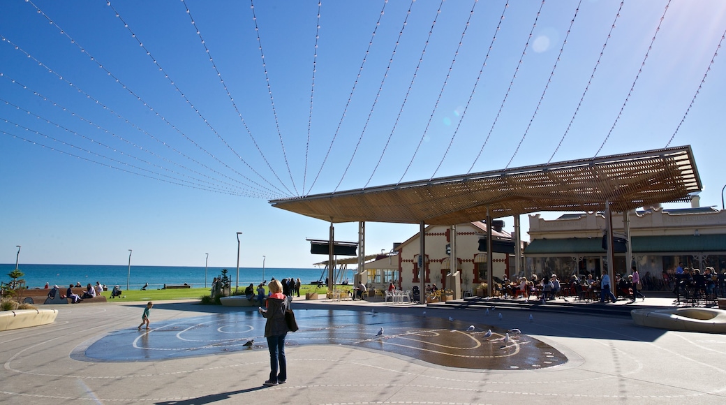 Henley Beach which includes a fountain and a square or plaza as well as a family