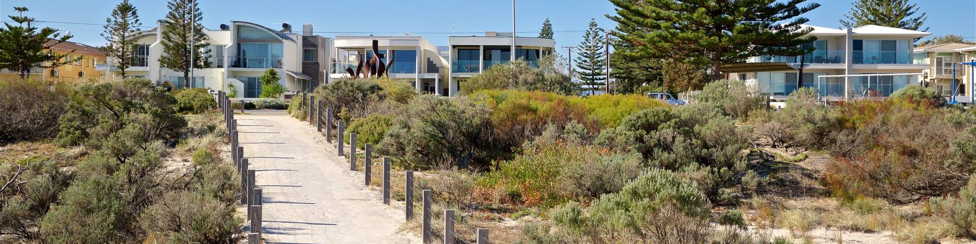 West Beach showing a coastal town and a beach