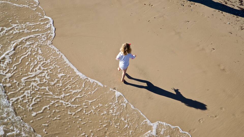 Brighton Beach showing general coastal views and a beach as well as an individual child