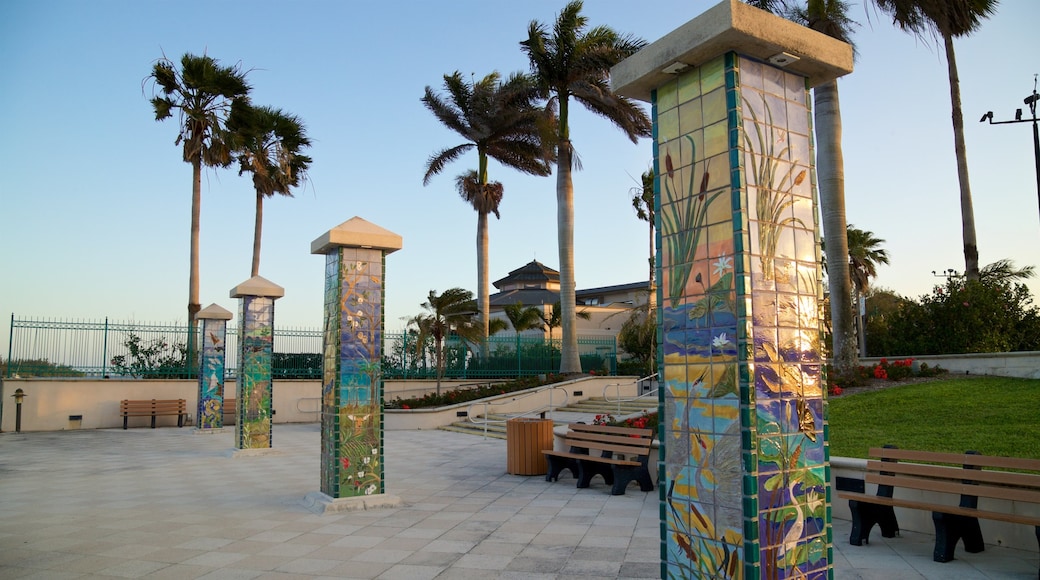 Royal Palm Pointe Park which includes outdoor art, a sunset and a garden