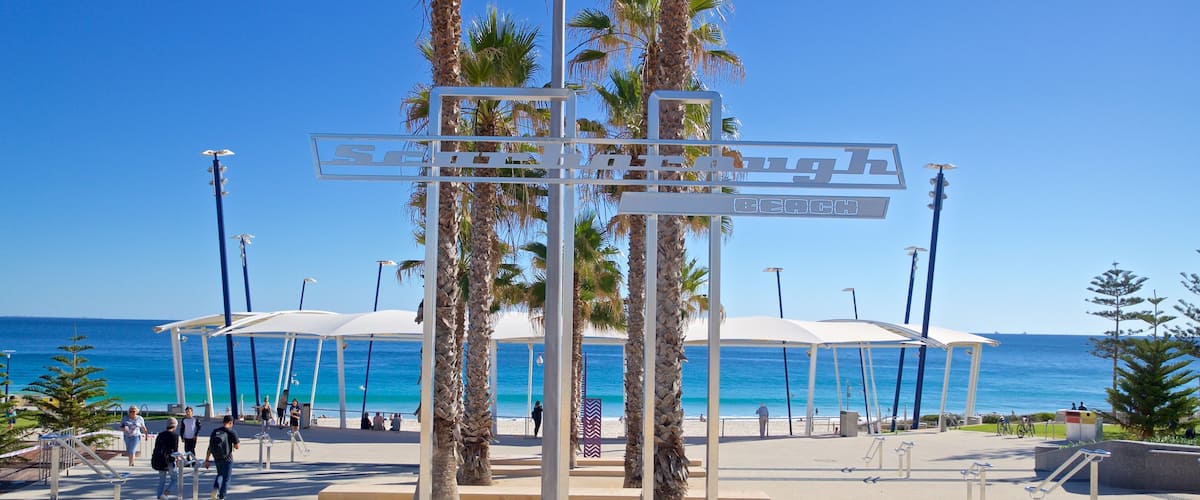 Scarborough Beach showing general coastal views and signage