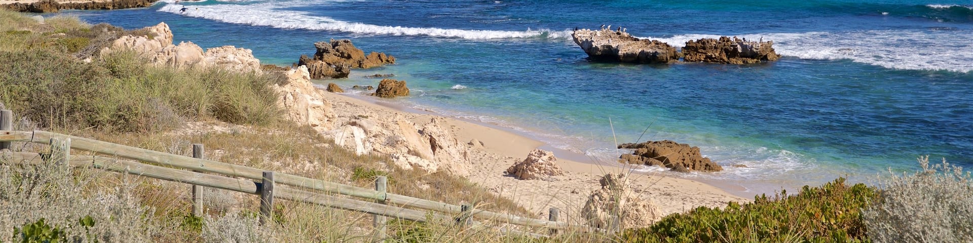 Trigg Beach which includes rugged coastline, landscape views and general coastal views