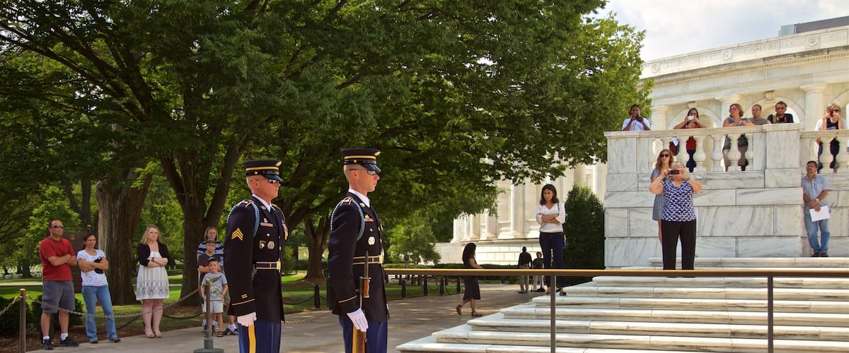 Tomb of the Unknown Soldier featuring military items as well as an individual male